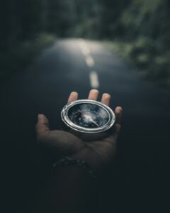 Client confidently navigating next steps with compass in hand